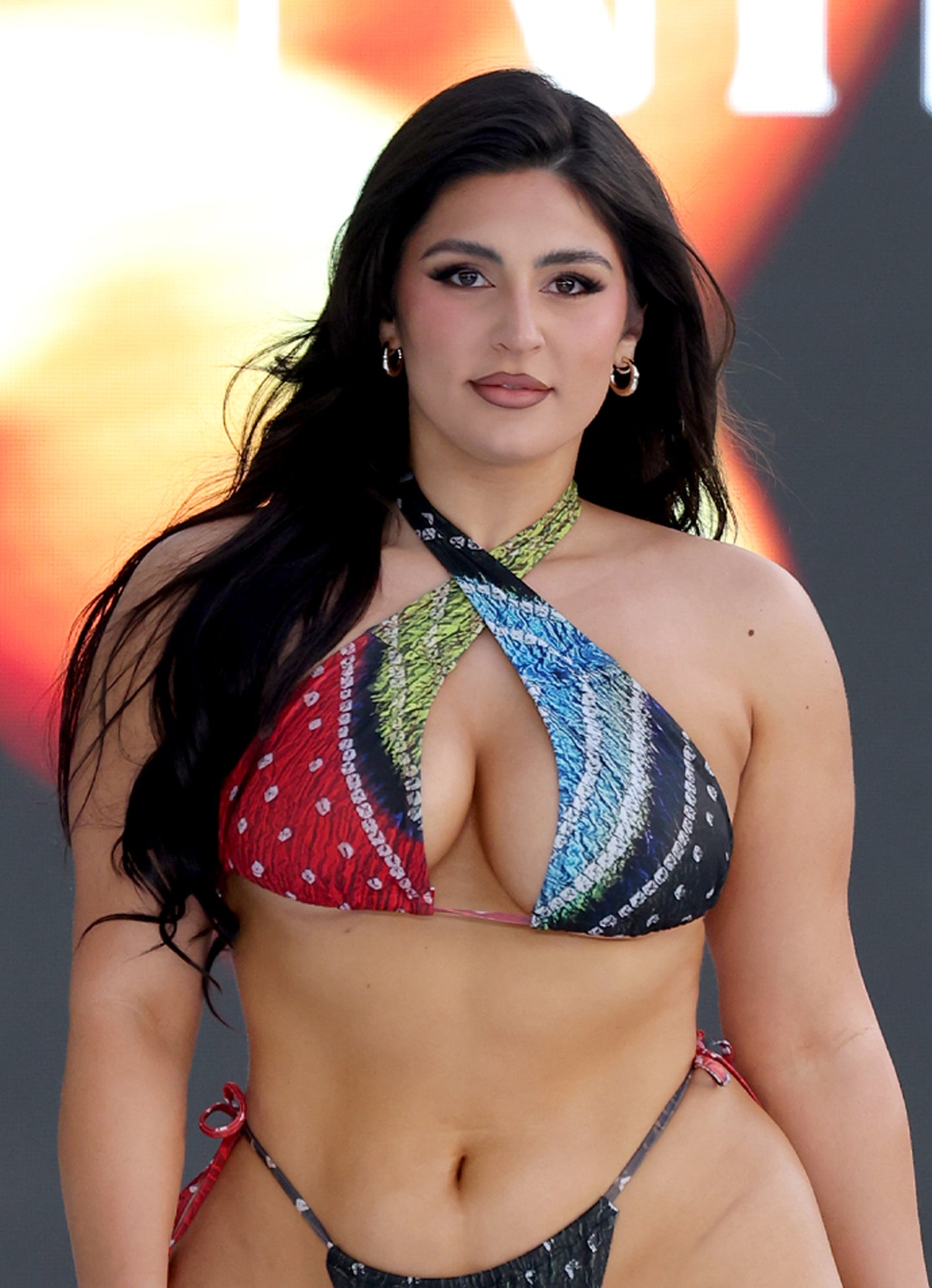 Model wearing Earth Halter Multiway Bikini Top – adjustable ruching at front for perfect fit