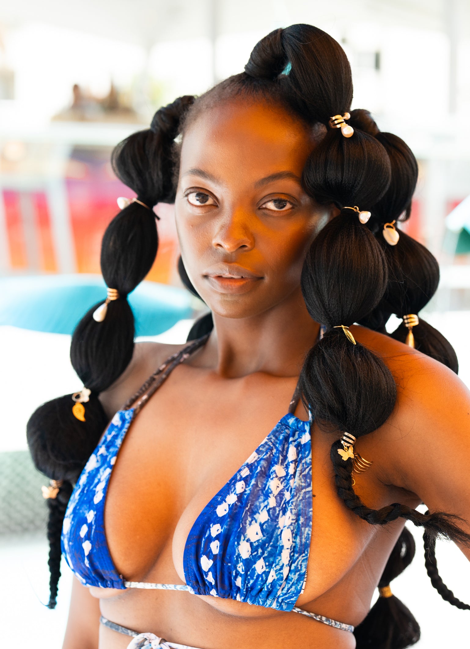 Model wearing Water Triangle Blue and White Bikini Top – can be styled in four different ways with neck and back ties